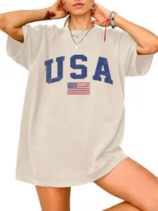 Women's oversized cream T-shirt featuring a vintage blue USA text and flag print