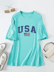 Detailed view of casual women's mint green oversized t-shirt featuring USA flag print