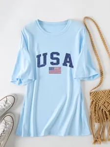 Detailed view of the USA flag print on a casual light blue oversized short sleeve T-shirt