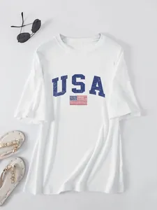 White oversized women's t-shirt with blue USA lettering and American flag print.