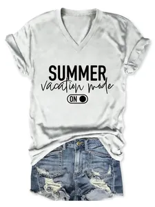 Close-up of white V-neck T-shirt with 'Summer Vacation Mode' print and denim shorts