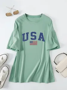 Close-up view of the USA flag graphic print on this loose sage green ruffled sleeve T-shirt