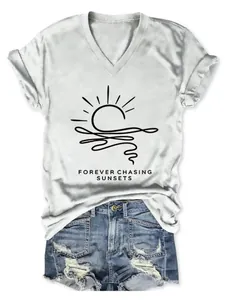Close-up of women's white V-neck T-shirt with 'Forever Chasing Sunsets' graphic