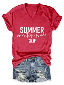 Close-up of a red V-neck T-shirt featuring a Summer Vacation Mode print with denim shorts.