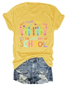 Detailed view of yellow t-shirt with 'Get Your Cray On' school graphic print