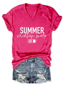 Detail of bright pink V-neck T-shirt with 'Summer vacation mode' slogan