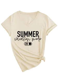 Detail view of the summer vacation mode slogan printed on a beige V-neck short sleeve T-shirt