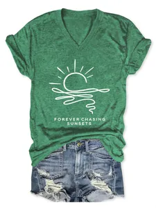 Detailed shot of a green V-neck T-shirt featuring a white sunset graphic print.