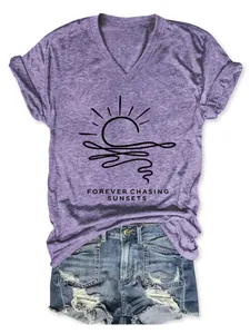 Detail of purple V-neck T-shirt with Forever Chasing Sunsets sunset graphic print.