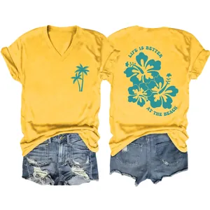 Detail of yellow V-neck tee featuring Life is Better at the Beach graphic and hibiscus flowers