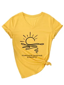 Detail of bright yellow V-neck T-shirt featuring 'Forever Chasing Sunsets' graphic.