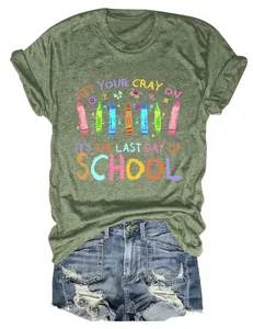 Flat lay view of a moss green T-shirt with 'Get Your Cray On' colorful crayon graphic
