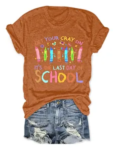 Close-up of rust orange T-shirt with colorful crayon school theme graphic design