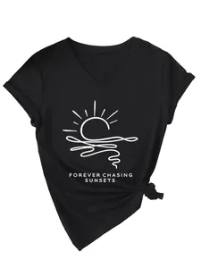 Close-up of black V-neck t-shirt with white sunset print and text detail