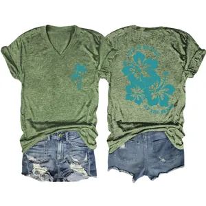 Casual green V-neck t-shirt with tropical flower back print and palm tree detail