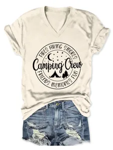 Detailed view of cream V-neck T-shirt with 'Camping Crew' and 'Fires Hiking Smores' print
