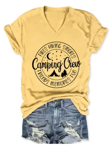 Casual yellow V-neck T-shirt with Camping Crew graphic and distressed denim shorts