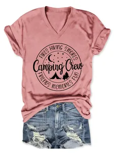 Front view of pink V-neck T-shirt with Camping Crew graphic print and denim shorts