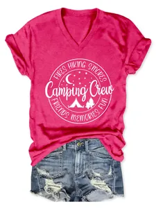 Close-up of the Camping Crew graphic on a magenta women's V-neck t-shirt.