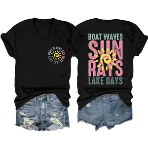 Detail view of colorful front and back graphic prints on black women's V-neck holiday T-shirt.