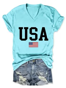 Detail view of women's USA flag print V-neck T-shirt in light blue and denim shorts