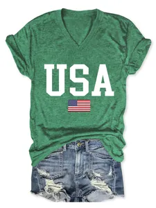 Close-up of green ladies V-neck T-shirt with USA flag print and distressed denim shorts