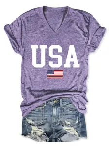 Close-up view of purple V-neck t-shirt featuring a USA flag print and denim shorts outfit