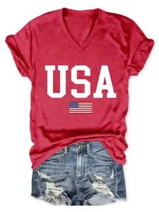 Close-up of a red V-neck T-shirt with USA text and flag print paired with denim shorts.