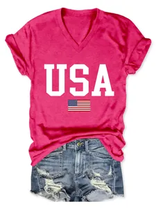 Close-up of pink V-neck T-shirt featuring USA text and American flag graphic print.