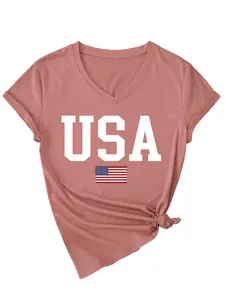 Macro view of the white USA print and American flag detail on a terracotta V-neck T-shirt