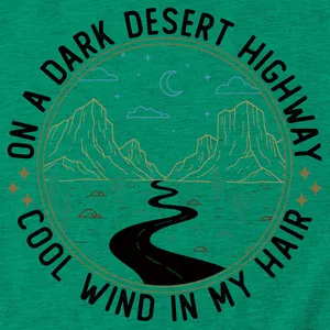 Détail d'impression graphique d'un t-shirt vert avec motif de route du désert.