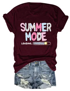 Close-up of women's maroon T-shirt with Summer Mode Loading print and denim shorts
