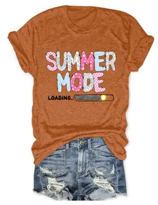 Detail view of orange t-shirt with Summer Mode Loading print and denim shorts outfit.
