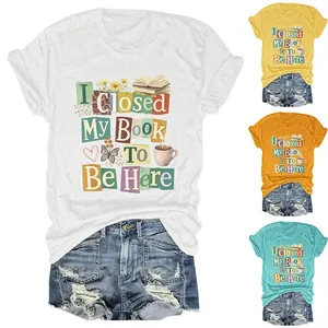 Detailed view of women's round neck t-shirts with 'I Closed My Book To Be Here' graphic