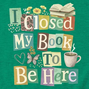 Detailed close-up of 'I Closed My Book To Be Here' colorful graphic print on green T-shirt