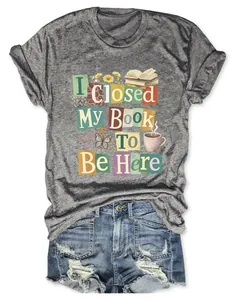 Close-up of women's grey heather t-shirt featuring I Closed My Book To Be Here graphic