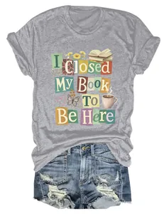 Close-up of grey women's t-shirt with I Closed My Book To Be Here graphic print style.
