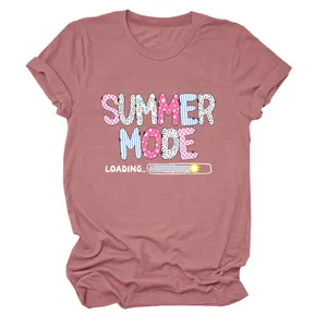 Close-up of the Summer Mode Loading colorful graphic print on a pink mauve T-shirt.