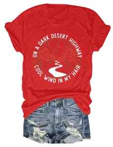T-shirt rouge vintage avec motif désert et texte détaillé 'Cool Wind In My Hair'.