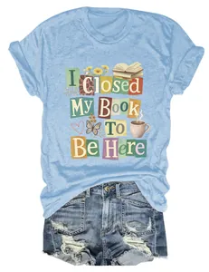 Detail of women's blue crew neck t-shirt with I Closed My Book To Be Here graphic print