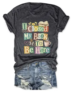 Macro view of graphic print I Closed My Book To Be Here on charcoal heather T-shirt