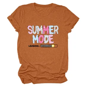Close-up of burnt orange T-shirt featuring a Summer Mode Loading graphic print.