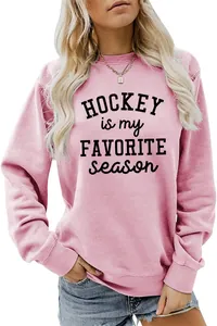 Close-up of pink crewneck sweatshirt featuring a Hockey Is My Favorite Season print