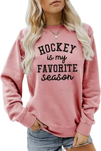 Close-up detail of pink sweatshirt with Hockey Is My Favorite Season black letter print