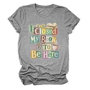 Detail view of grey women's crewneck T-shirt featuring 'I Closed My Book To Be Here' print
