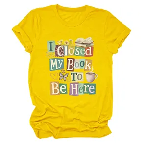 Detailed view of yellow crew neck T-shirt featuring 'I Closed My Book To Be Here' print
