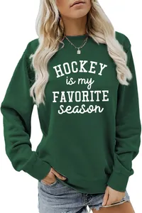 Macro view of 'HOCKEY is my FAVORITE season' print on dark green sweatshirt fabric