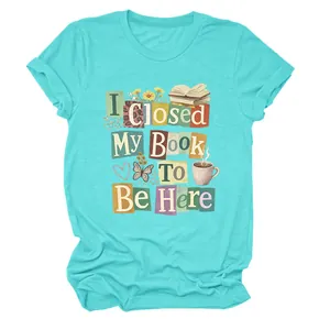 Teal women's T-shirt featuring I Closed My Book To Be Here text and book illustrations