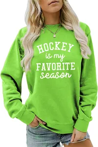 Close-up of vibrant green sweatshirt with Hockey Is My Favorite Season slogan print