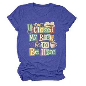 Detail view of the colorful book-themed graphic print on a blue women's T-shirt.
